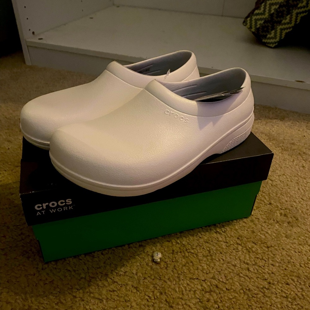 All white crocs. Great for nursing school students. $25 New in box, never worn.